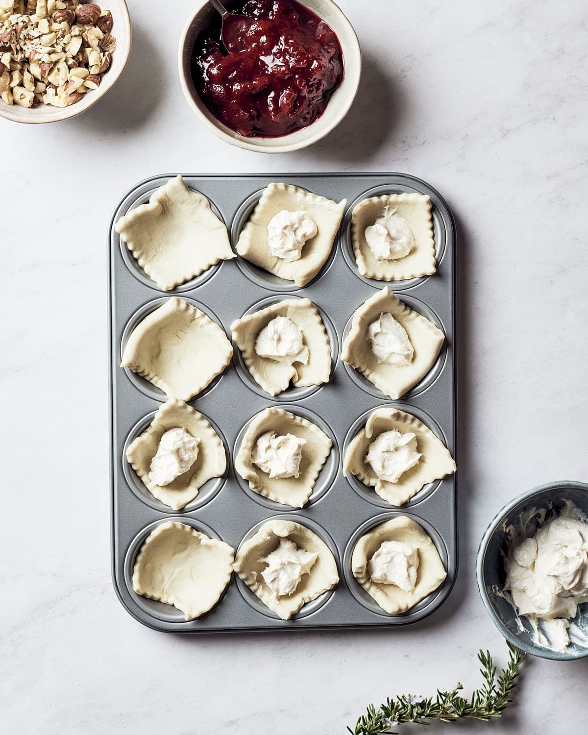 Vegan Cranberry Cream Cheese Bites - Pastry squares in mini muffin tin with vegan cream cheese