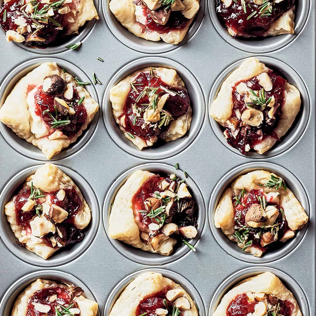 overhead view of puff pastry bites in mini muffin tin