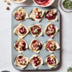 Overhead of mini muffin tin filled with vegan cranberry bites