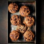 Overhead view of Vegan Banana Chocolate Chip Muffins in a metal tray.