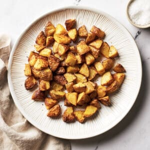 top view of plate of air-fried breakfast potatoes with flakey salt