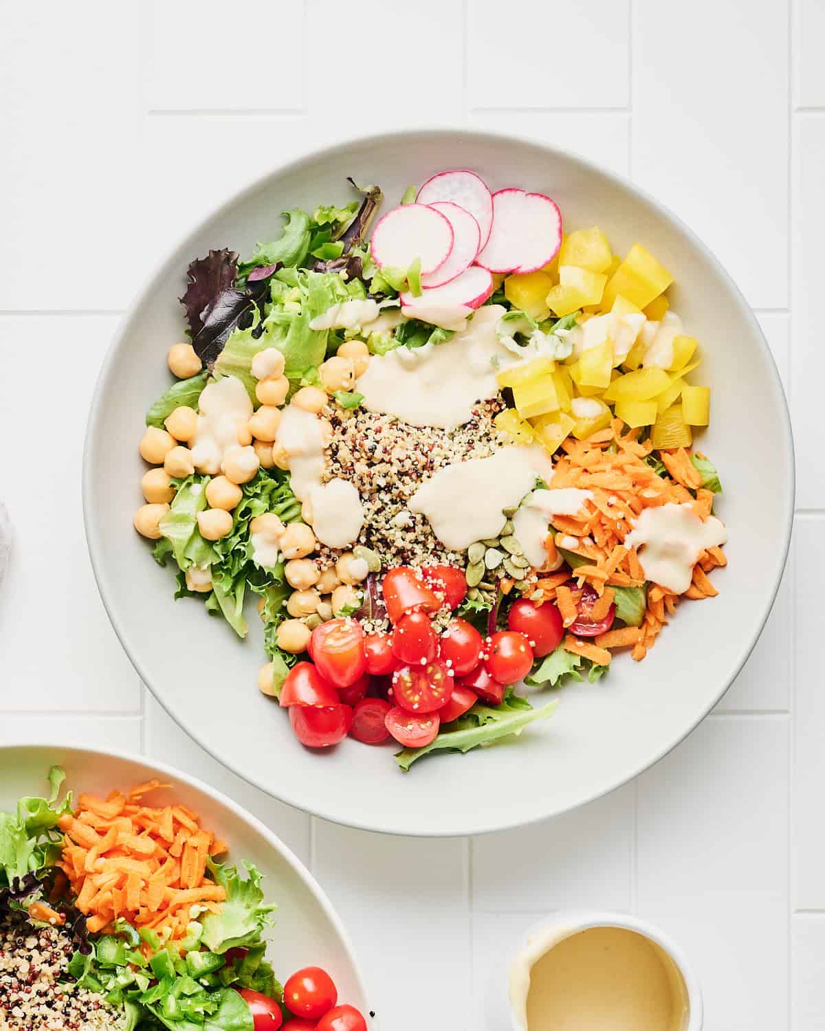 Bowl of Quinoa Chickpea Salad with lemon tahini dressing.