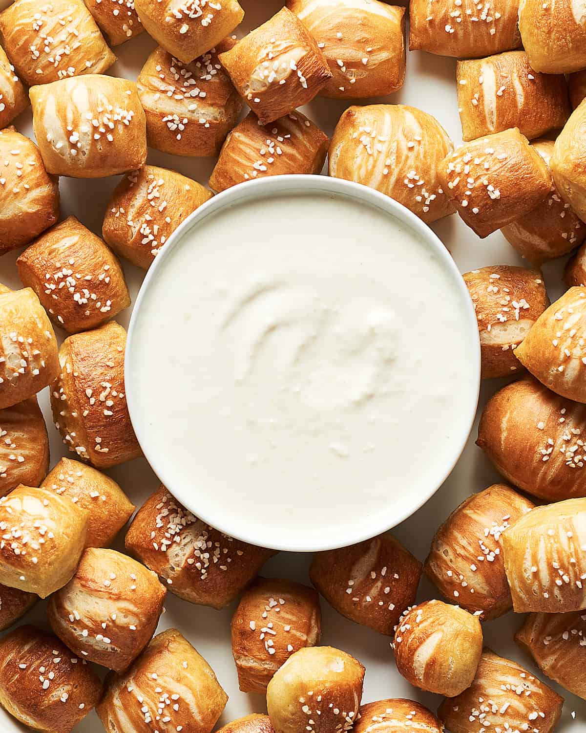 vegan soft and chewy pretzel bites with creamy horseradish aioli