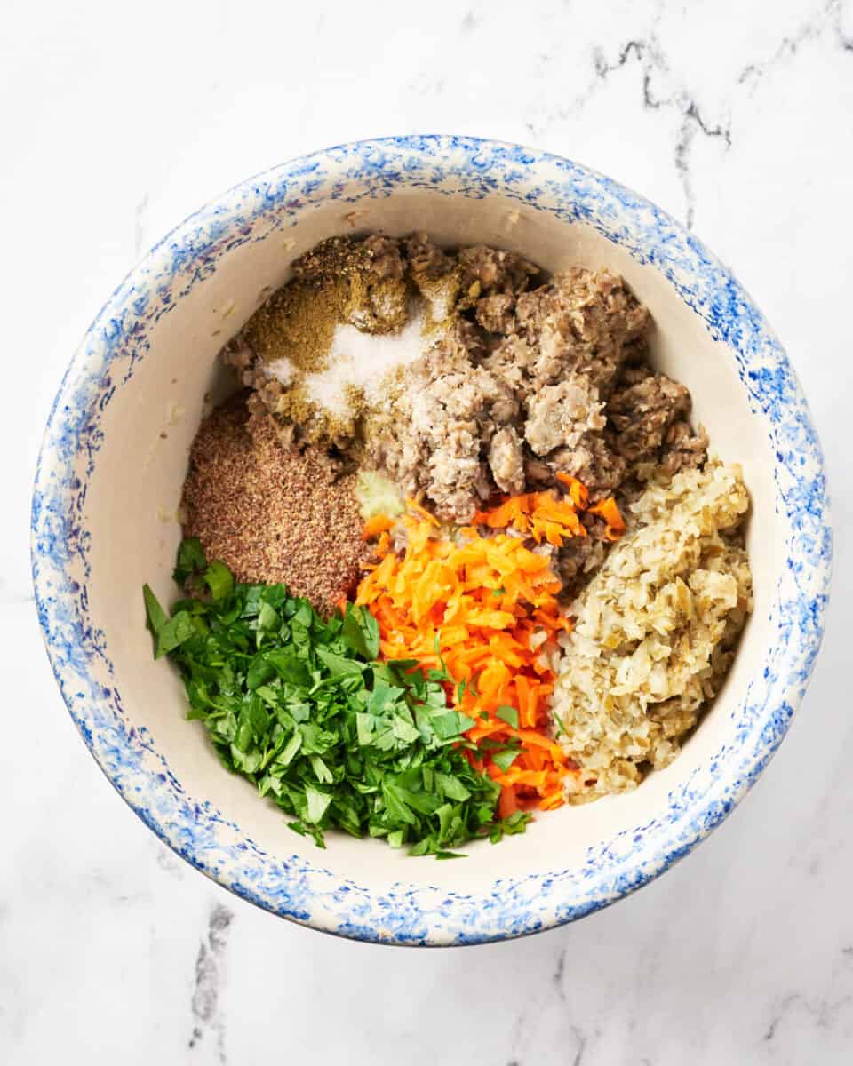 Assembling ingredients in bowl for vegan meatloaf recipe