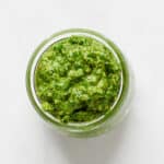 Overhead of Vegan Walnut Pesto in glass jar.