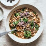 Overhead view of vegan black-eyed pea stew with spoon.