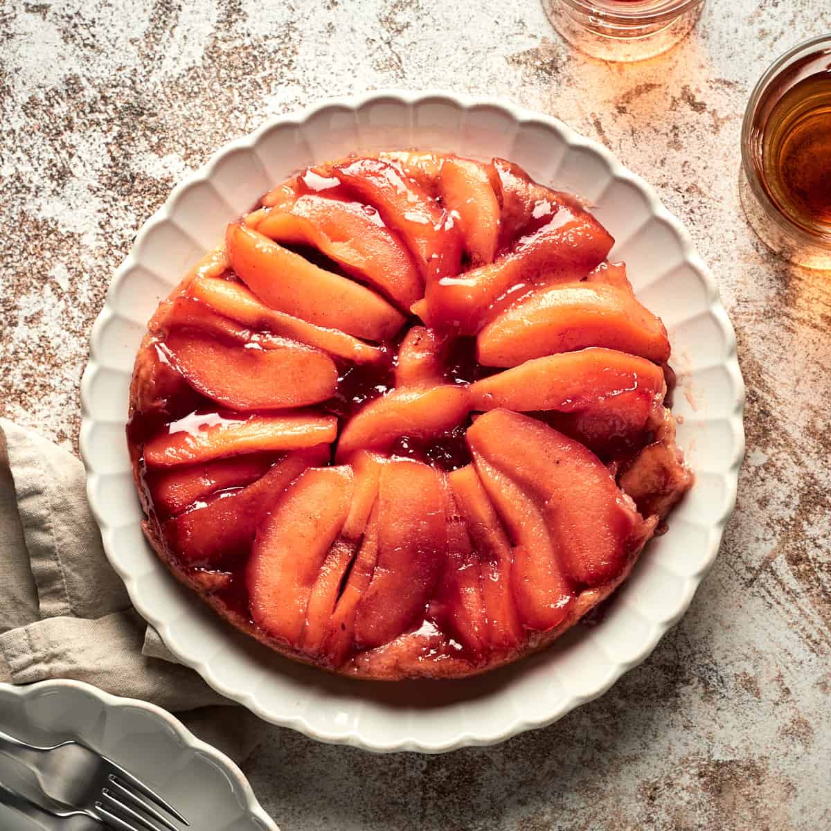 Top view of vegan quince tarte tatin on plate.