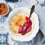 Overhead view of bowl of vegan cream of wheat with plum and ginger compote.