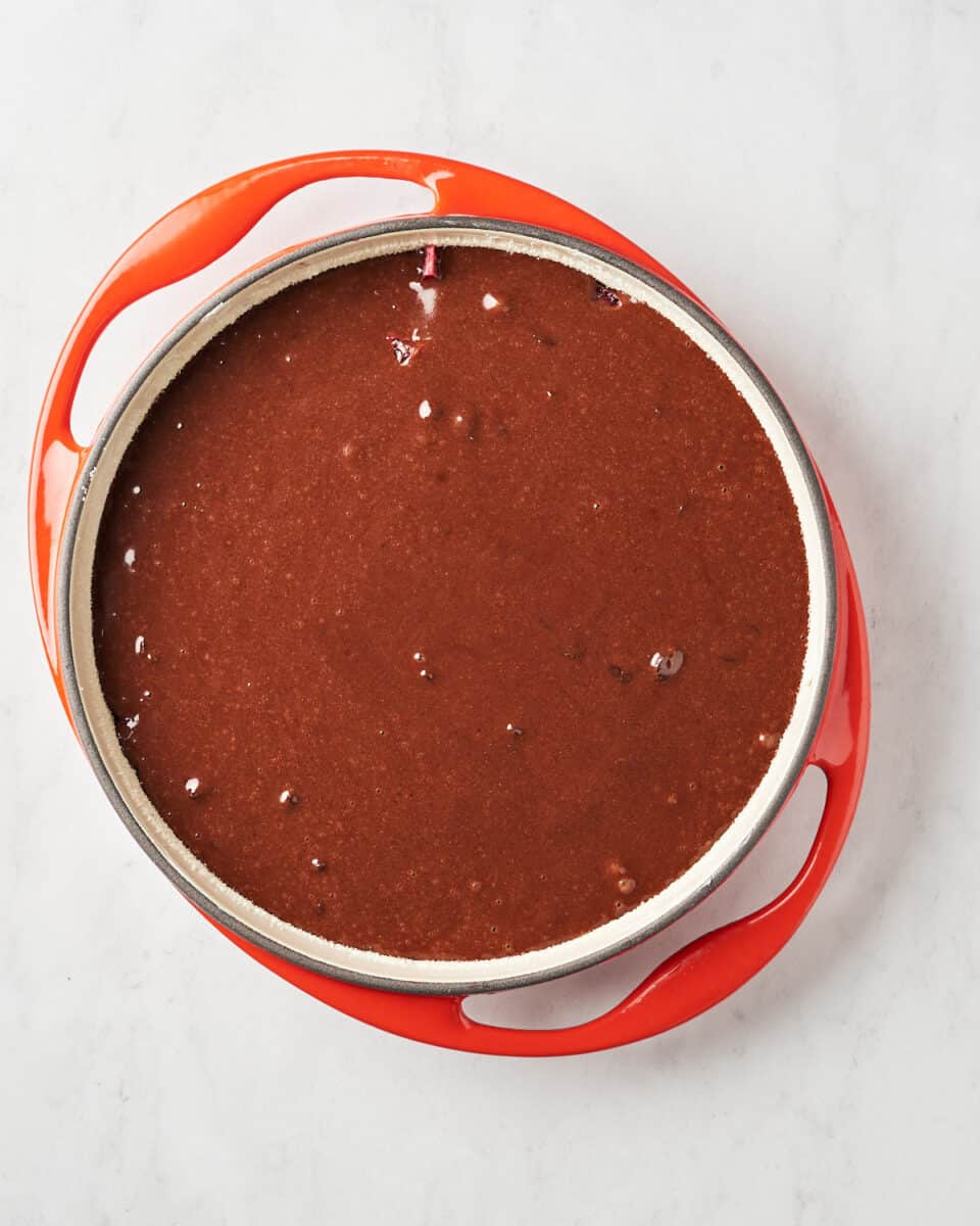 Top view of liquid cake batter in cake pan.