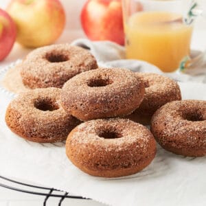 Side view of close up view ot baked vegan apple cider donuts.