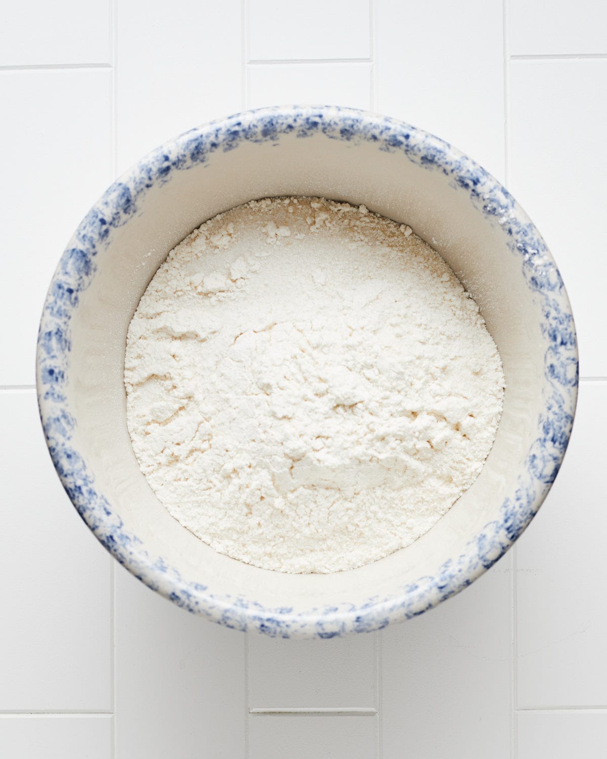 Overhead view of a bowl with dry ingredients.