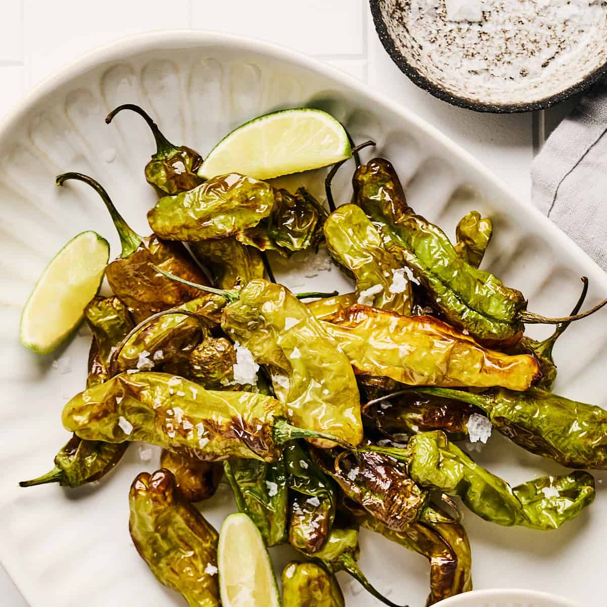 Air Fryer Shishito Peppers with lime and salt.