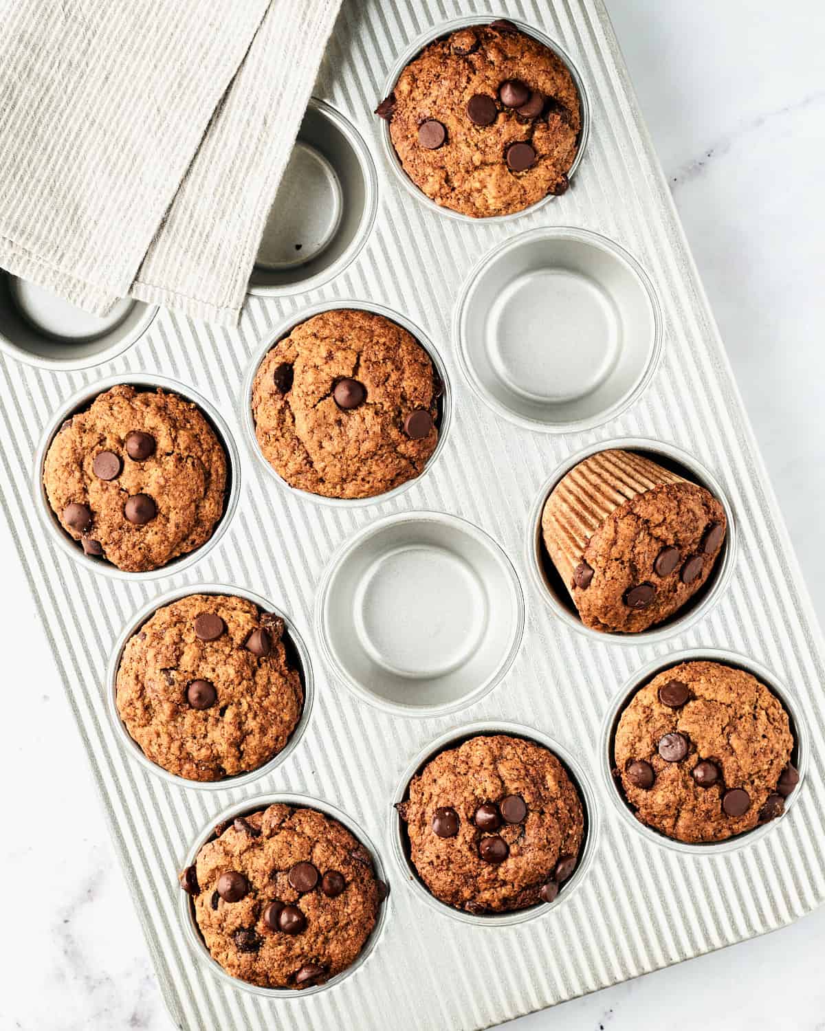Vegan Banana Chocolate Chip Muffins in a muffin tin.