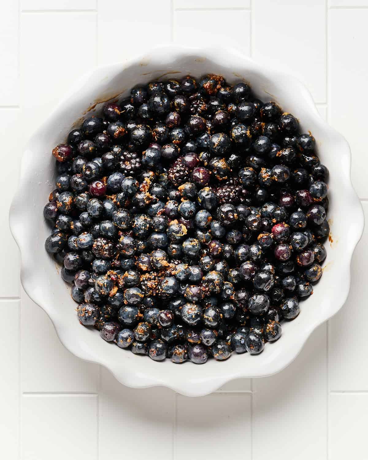 Blueberry fruit mixture placed in the pie dish.