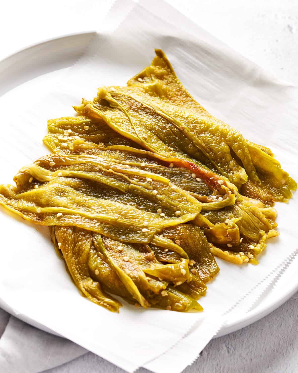Broiled and deseeded Hatch Chiles on a plate.