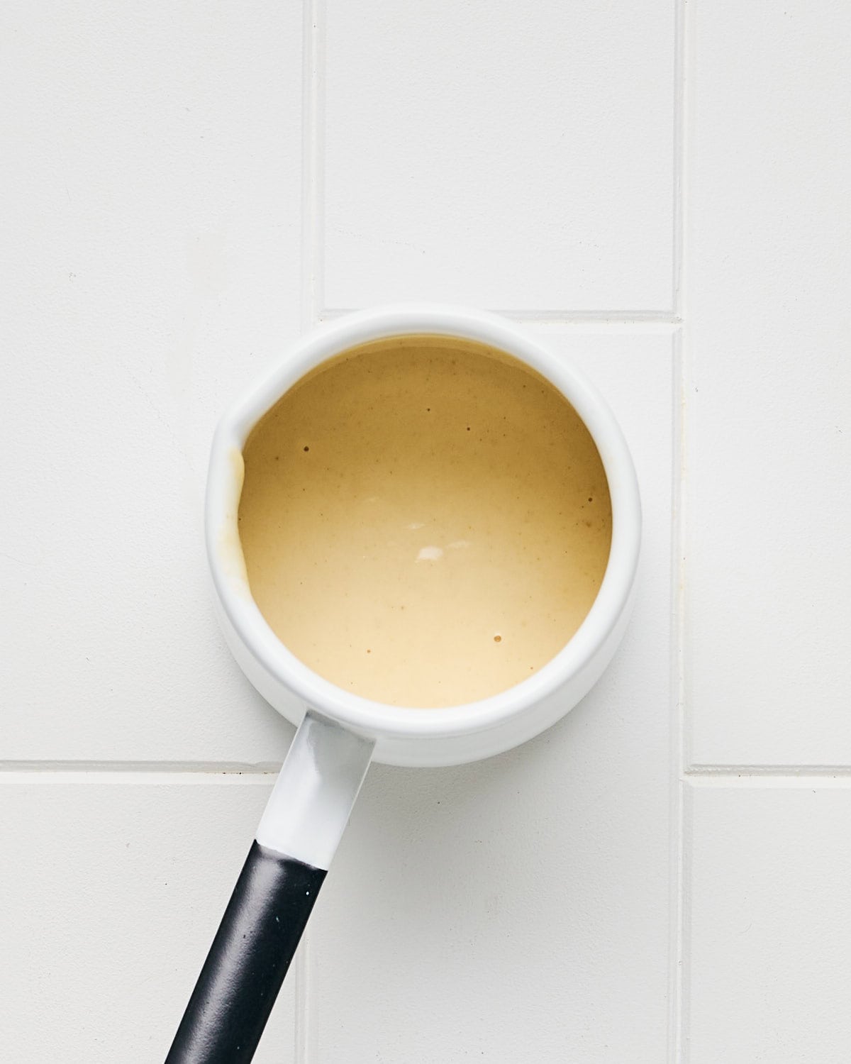 Lemon Tahini Dressing in a container.