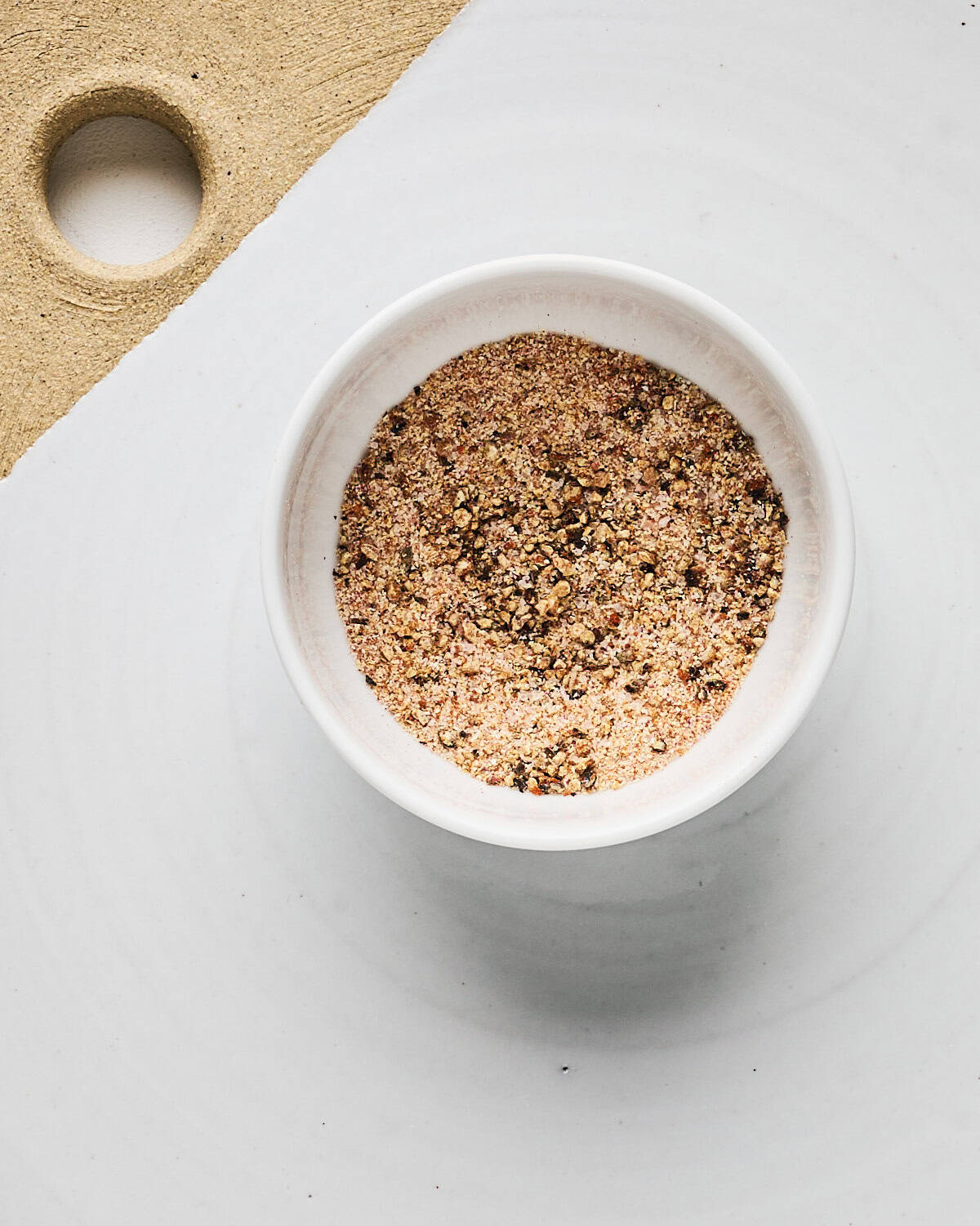 Small bowl of spice mixture for roasted cauliflower.