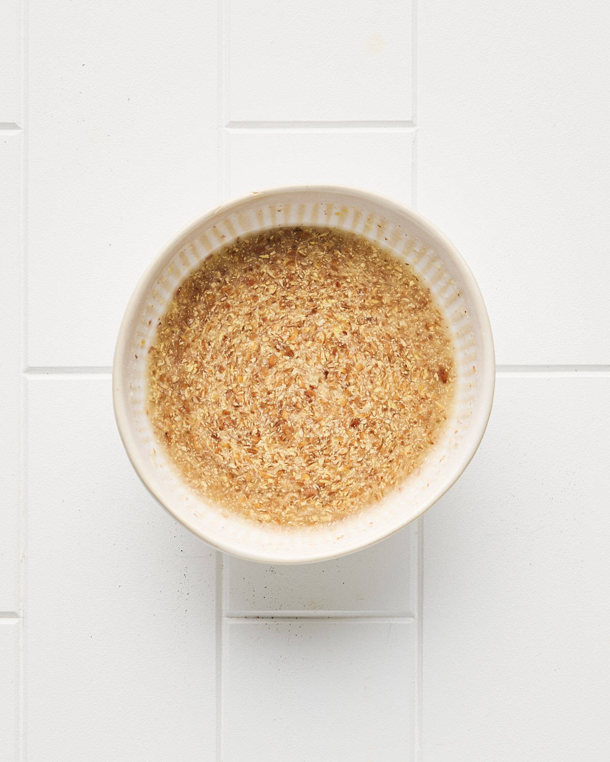 Small bowl of flaxseed meal mixed with water.