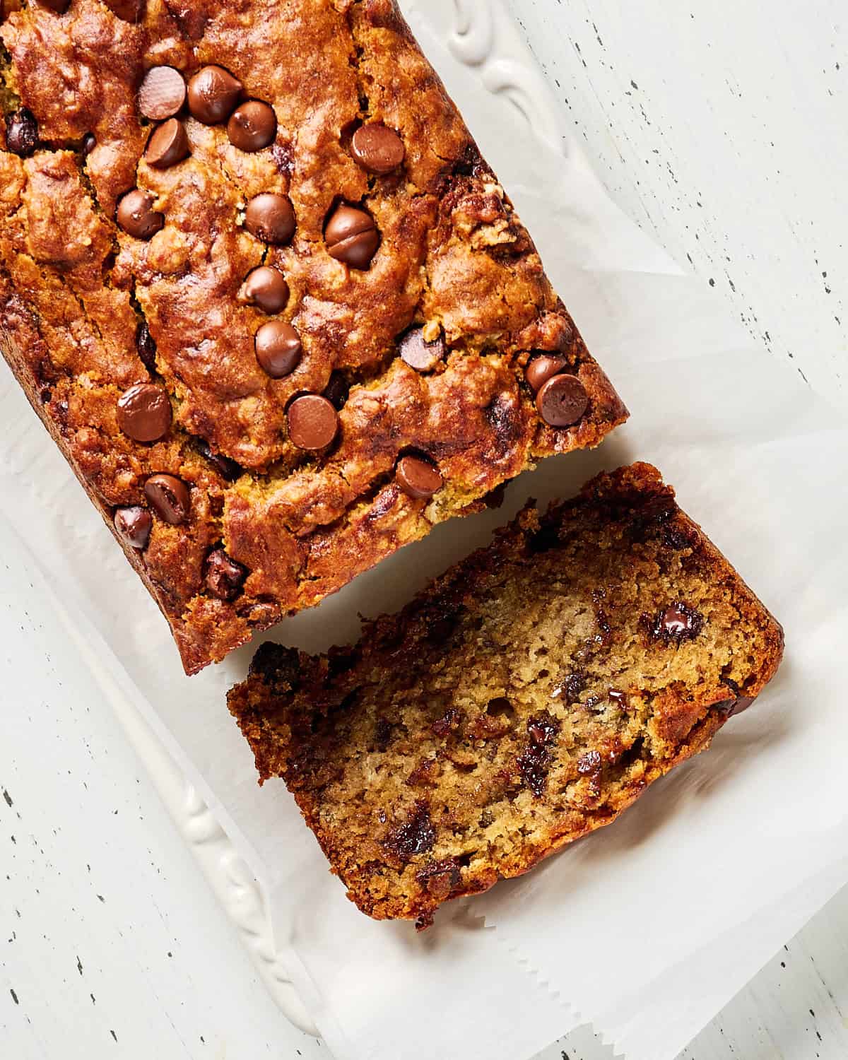Slices of Vegan Banana Bread with Chocolate Chips on a platter.