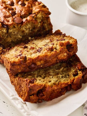 Two cut slices of a loaf of vegan gluten free banana bread.