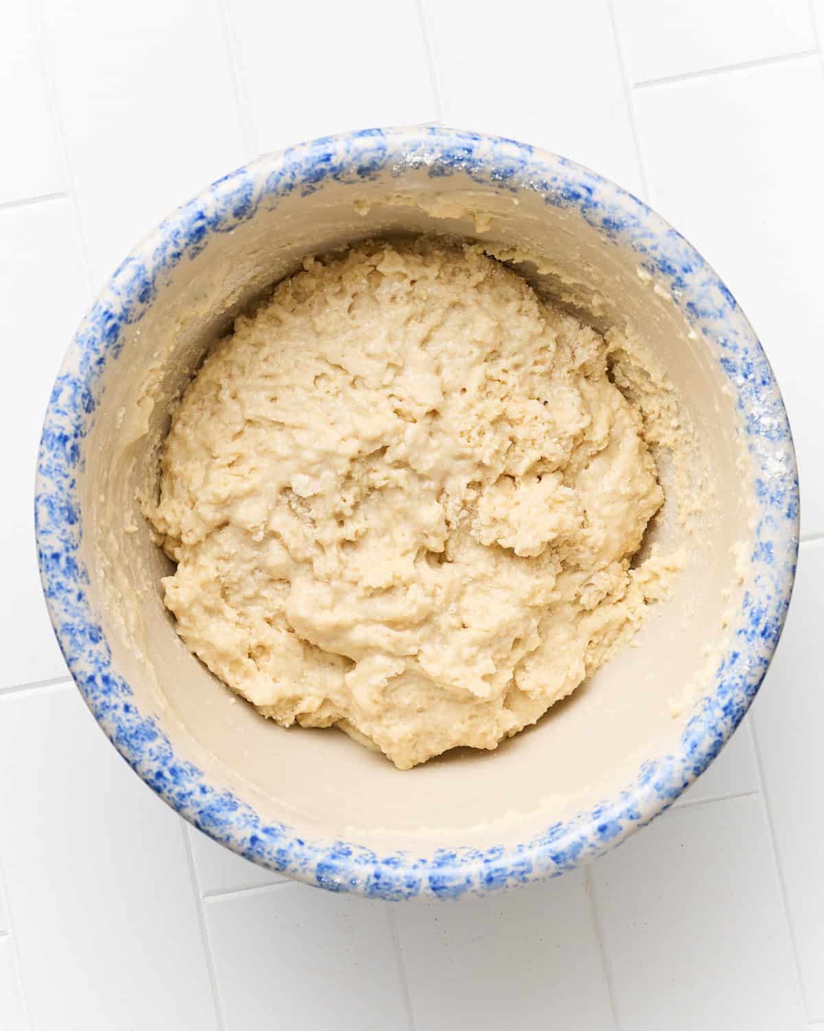 Ingredients to make the vegan cherry cobbler topping are mixed in a large bowl.
