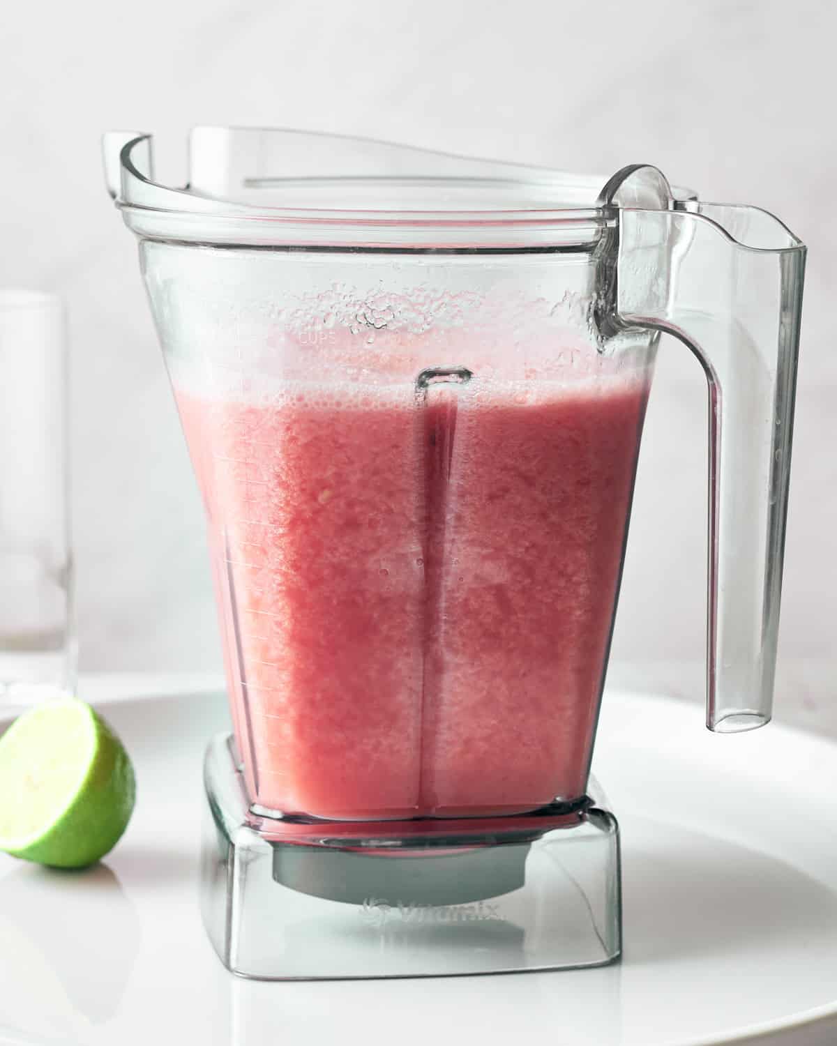 Freshly blended watermelon water in a blender pitcher.