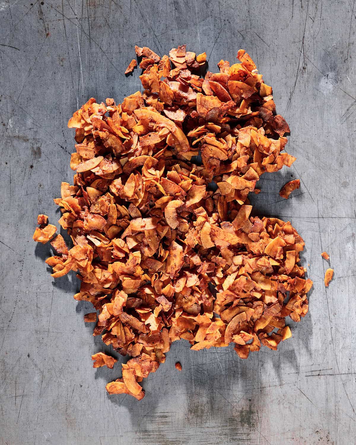Baked coconut bacon cooling.