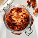 Coconut Bacon in a glass container.