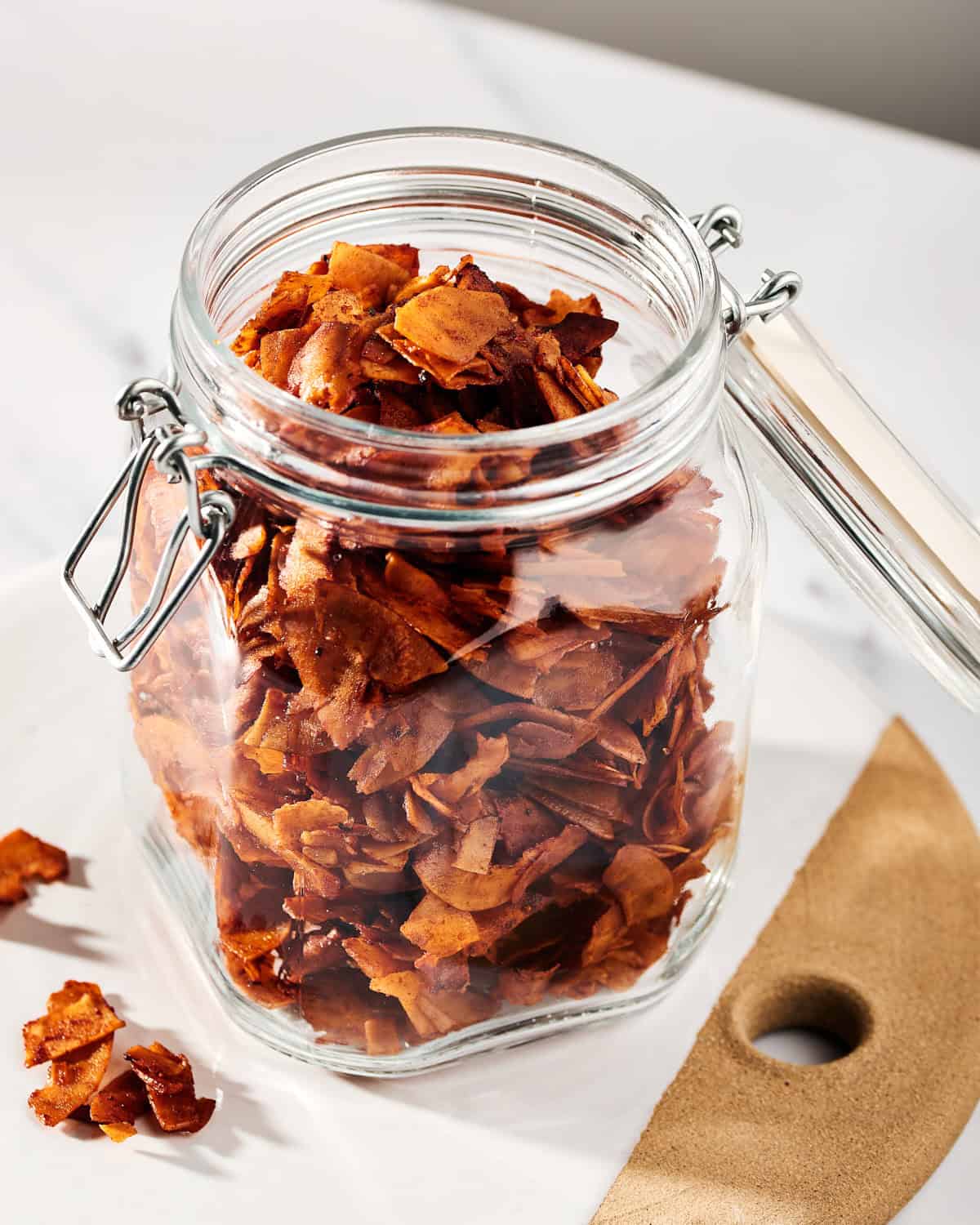 Coconut Bacon in a glass container.