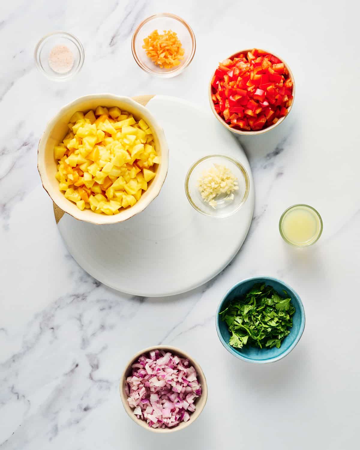 Chopped ingredients to make fresh mango habanero salsa.