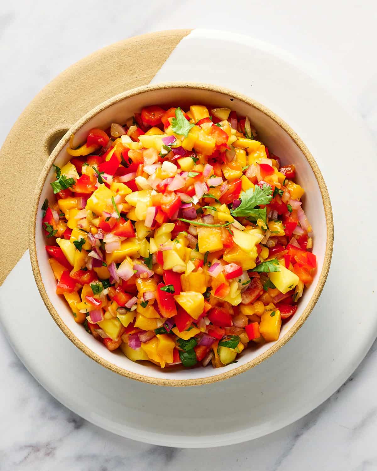 Mango Habanero Salsa in a bowl garnished with cilantro.