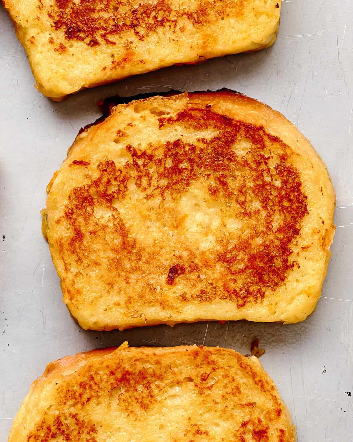 Slices of vegan JUST Egg French Toast made with Grand Marnier on a baking sheet.